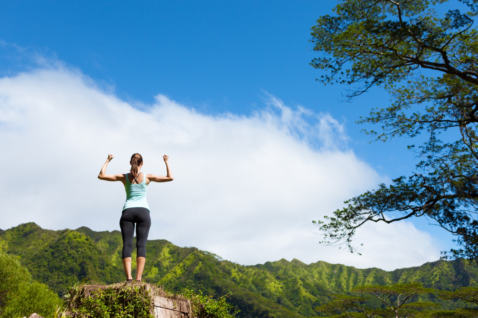 Woman strong and confident in Hawaii mountains